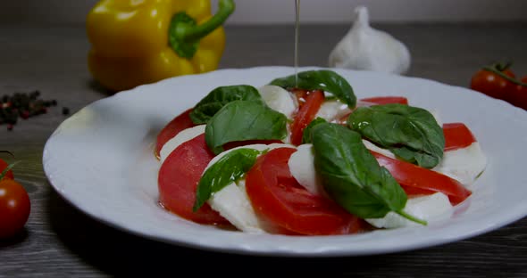 Caprese Salad With Pouring Olive Oil 04b
