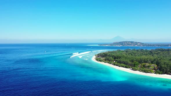 Aerial above abstract of luxury shore beach adventure by shallow ocean with white sand background of alt