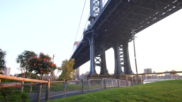 View From Under the Brooklyn Bridge in New York City USA on Sunny Day Green Grass, Sunlight  alt