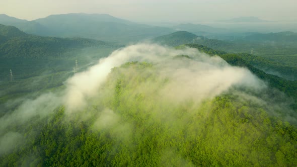 Landscape in the morning time during sunrise with fog above the mountain,