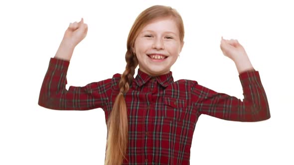 Young Funny Caucasian Girl with Plait of Hair Smiling and Jupming with Wide Arms Spread Open alt