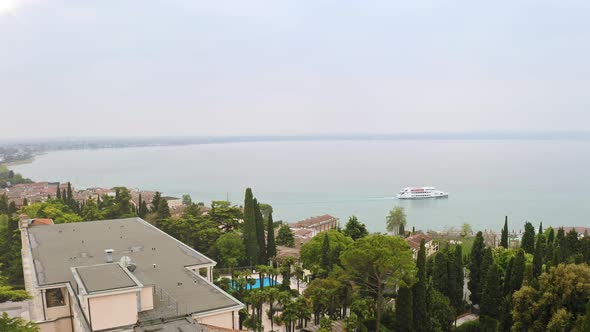 Aerial View Luxury Holidays on Shores of Island on Lake Garda Italy Luxurious Villas Beautiful Green alt