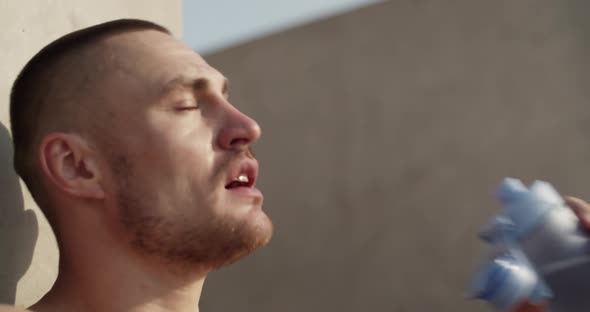 Sportsman Panting and Drinking Water alt