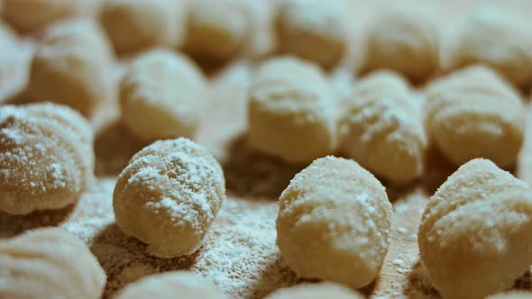 Chef Cutting Rolls of Potato Dough for the Preparation of Homemade Gnocchi Pleasant Atmosphere alt