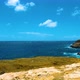 Cliff to the ocean in Honolulu, Oahu. Lanai lookout in Hawaii. Blue ocean waves hit mountain rocks. - VideoHive Item for Sale
