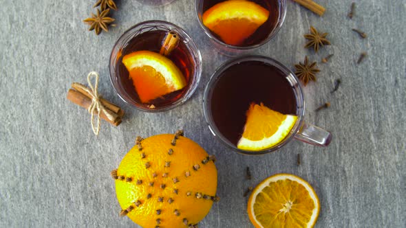 Glasses of Hot Mulled Wine with Orange and Spices alt