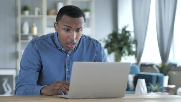 Loss, Frustrated Young African Man Working on Laptop alt