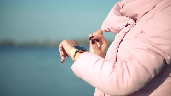 Female Checking Pulse On Smartwatch App. Girl Using Smart Watch Wearable Wristband Device. alt