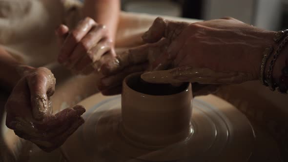 Potter Teach Teenager Working with Pottery Wheel alt