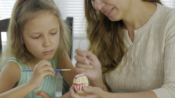 Mother Woman With Daughter Girl Coloring Eggs For The Bright Holiday Easter alt