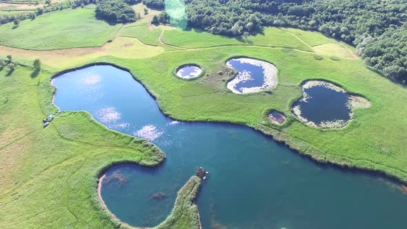 Aerial view of lakes called Sarena jezera near town of Knin alt