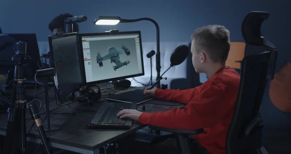 Boy Working on a 3d Model in an Office alt