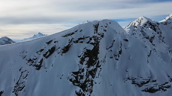 Aerial View of Cheget Mountain Range in Snow in Winter in Sunny Clear Weather alt