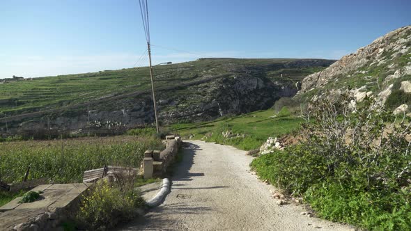 Walking in Gozo Island Outskirts Valley on Sunny Day