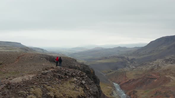 Aerial View Flying Toward Two Tourist Hiker Enjoying Amazing Panorama of Fossa River Valley in alt