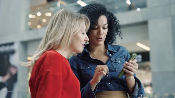 Beautiful Smiling Female Customers Use Smartphone Browse Internet Choose Stylish Clothes alt