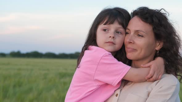 Portrait of a Child with Mom on Nature alt
