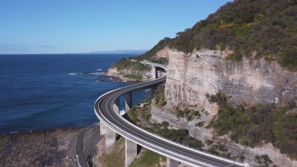 close up aerial clip of sea cliff bridge- flying forward to the south alt