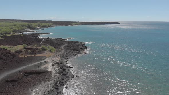 Beautiful 4k drone shot of black sand volcanic beach. Southwest of Hana, Maui. alt