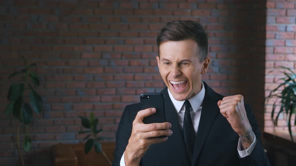Portrait of Businessman Using Smartphone