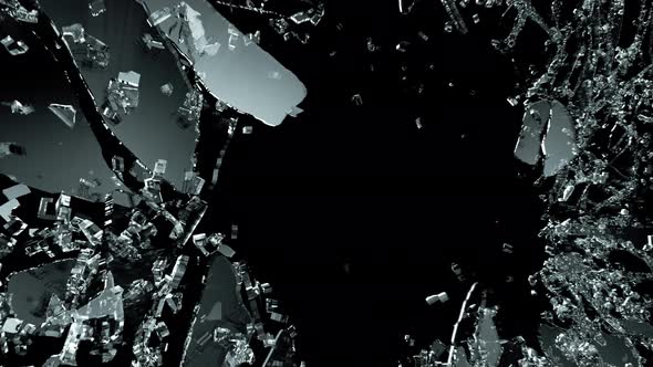 Pieces of destructed Shattered glass in slow motion. Alpha matte