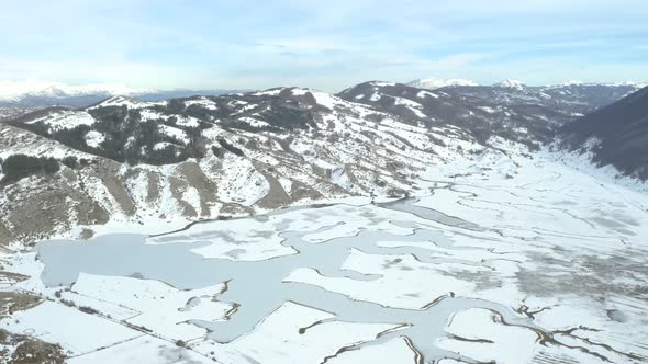 Aerial view shot of Altopiano di Rascino, frozen lakes in Italy