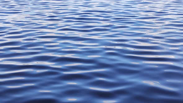 Blue water background seamles loop, blue azure turquoise sea water