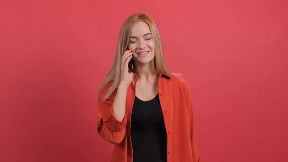 Portrait of Happy Young Woman Having a Pleasant Mobile Conversation. alt