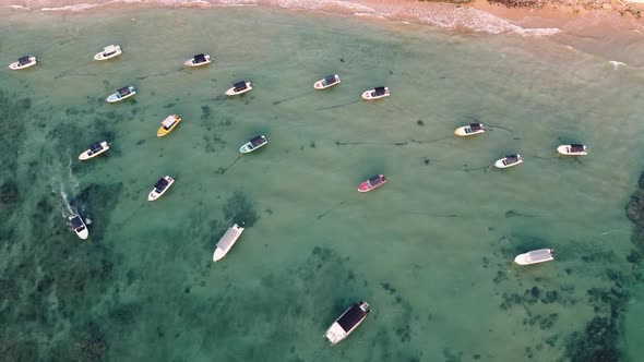 Speed Boats in the Blue Lagoon Near the Tropical Beach