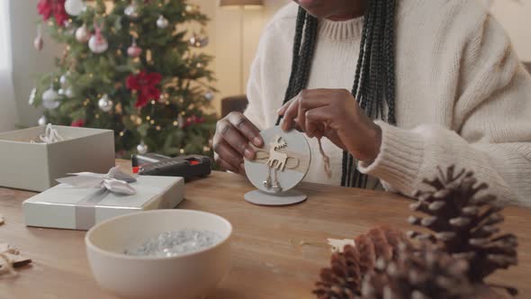 African-American Woman with Handmade Christmas Decoration alt