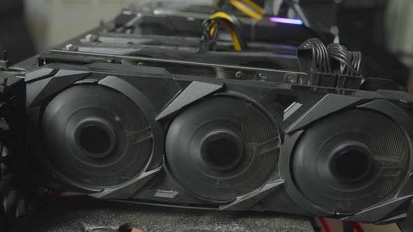 Close Up Of Cryptocurrency Mining Rig Working, Fans Of Graphic Card Working alt