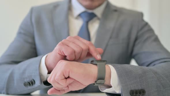 Close Up of Businessman Using Smart Watch Internet alt