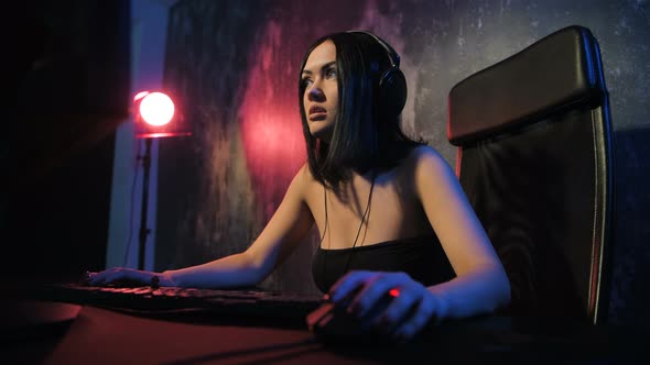 Woman Starts Online Game with Her Friends. Gamer Girl Playing Online Game on a Pc Computer alt