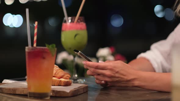 Women's Hands with a Phone alt