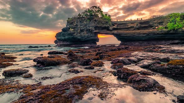 Dramatic Sunset at Epic Rocky Batu Bolong and Tanah Lot Temple in Bali, Indonesia. Timelapse  alt