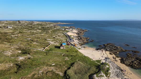 Rocky Coast Of Coral Strand Beach By The Calm Blue Sea In Carraroe, County Galway, Ireland During Su alt
