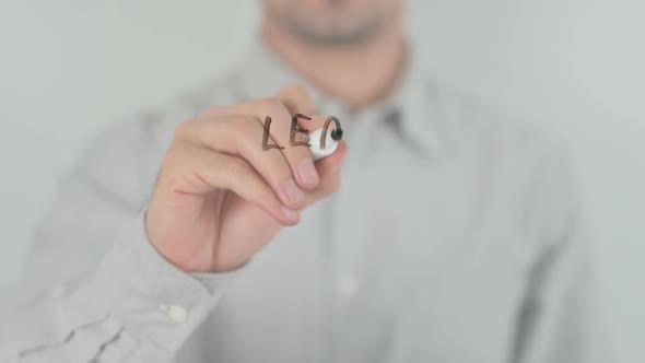 Change is Coming Man Writing on Transparent Screen alt