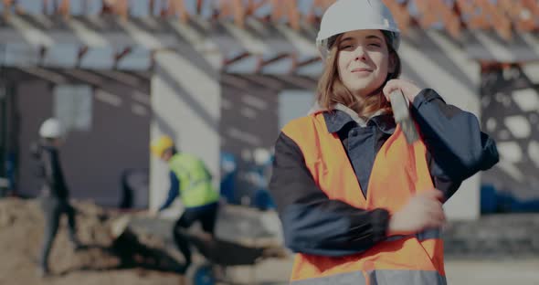 Confident Female Supervisor Carrying Level Tool on Shoulder alt