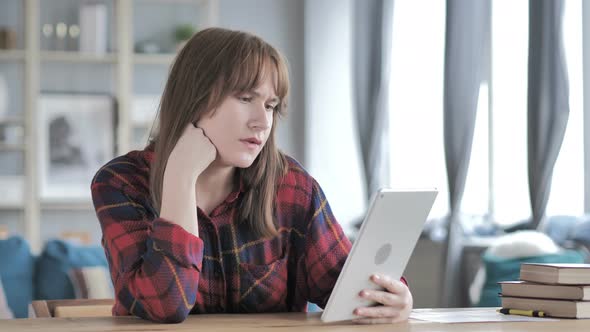 Video Chat on Tablet by Young Woman alt