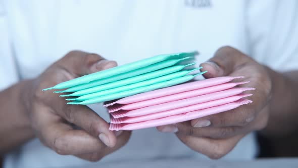 Holding Colorful Paper Bubble Envelope alt