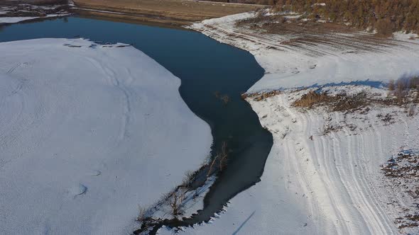 Flight Over A Dam On A Snowy Winter Day alt