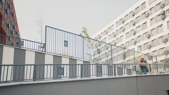 Courier Woman is Looking for Mobile Phone to Deliver Address of Food From a alt