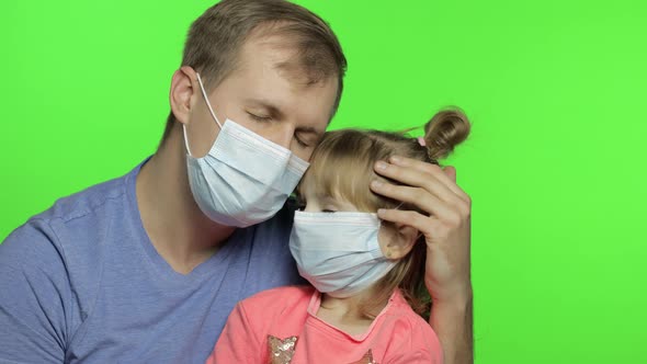 Sick Father and Daughter in Medical Mask. Coronavirus Concept. Family Quarantine alt