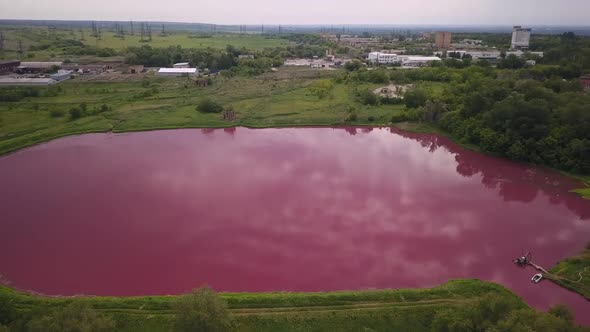 Lake with Pink Water in Industrial Zone, Aerial View, Pollution By Toxic Chemicals