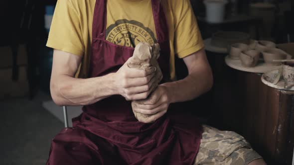 Serious Woman Working at Pottery Wheel in Studio Prepare Clay to Make Plate to Restaurant alt
