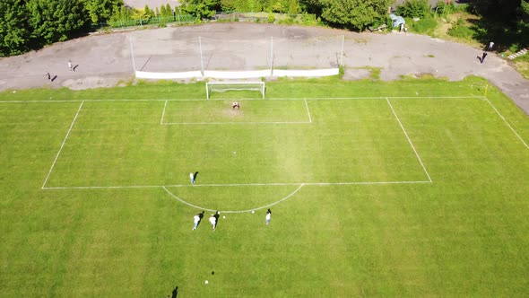 Training Of A Professional Football Team At The Stadium. Footballers Train Shots On Goal.