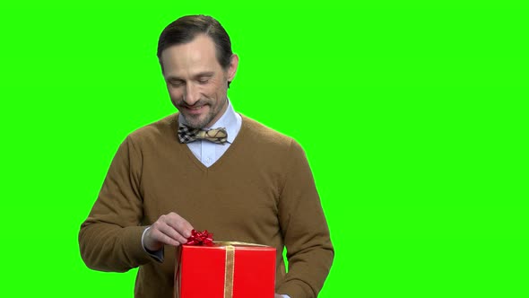 Caucasian Man Showing Gift Box alt