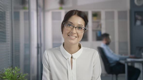 Cute Sexy Woman with Beautiful Style in Glasses in Office Place Look and Smile alt