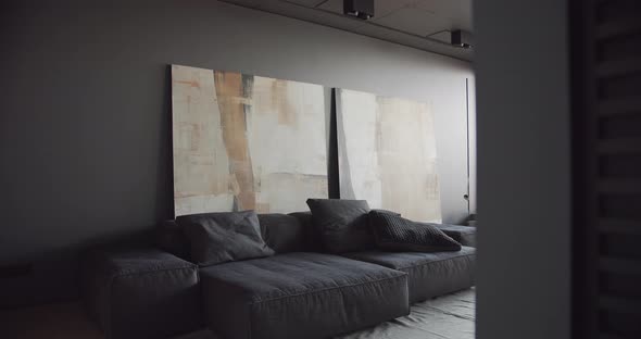 The Modern Minimalist Living Room with Black and Gray Tone Large Paintings alt