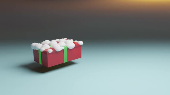 Gift in red box with green ribbon floating in the air. Snow. New year and Christmas present.